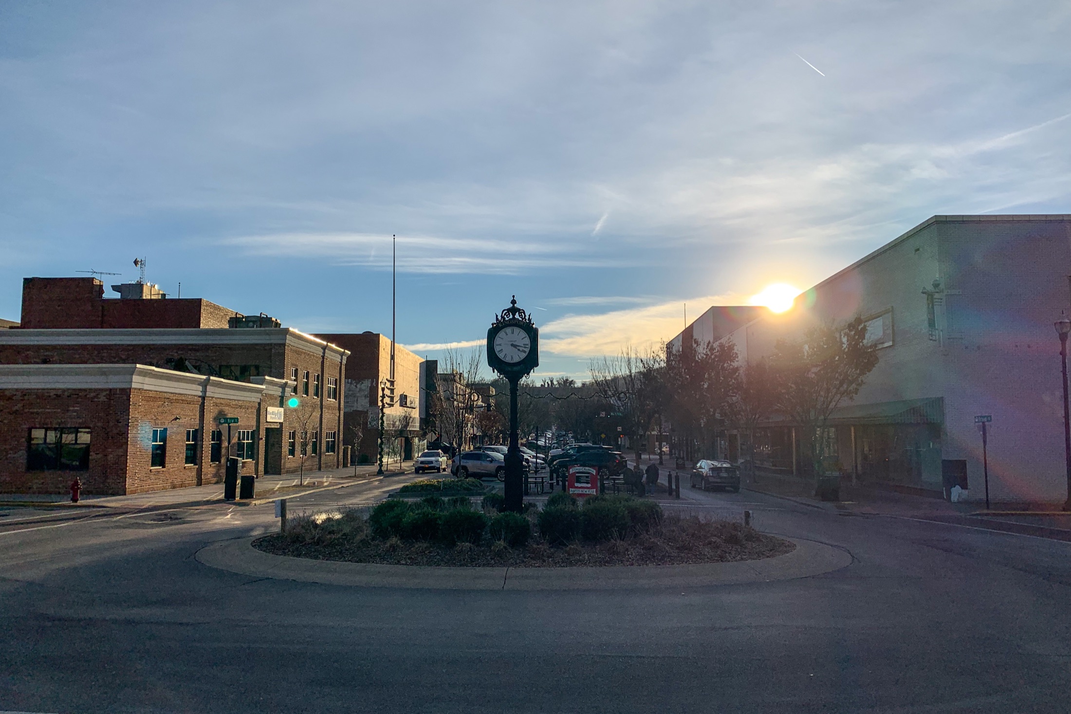 Broad Street in downtown Kingsport, Tennessee, with the street clock, storefronts, and wooded hills